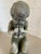 Unusual antique Victorian quality lead figure of a satyr musician sat upon a rock playing a flute type instrument. In...