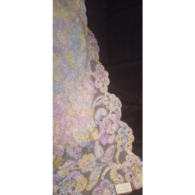 Imported Floral embroidered French Lace fabric. Scalloped edges 33" wide 9 yards. White netting with yellow, violet. blue...