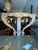 A handcrafted 1950s Venetian-style console table featuring a wooden frame covered with various types of seashells. This...