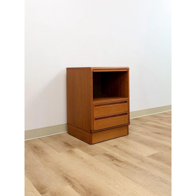 This beautifully crafted vintage Danish modern teak nightstand by Torring Mobelfabrik is a genuine and collectible...