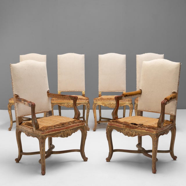 Set of 6 ( 4 + 2 arms ) French dining chairs manufactured by M Hirch on cabriole legs with stretchers in original gilded...