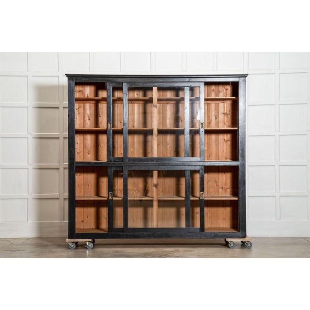 Circa 1880 Large English 19thC Ebonised Glazed Housekeepers Cabinet (Safety glass fitted) W211.5 x D52 x H190.5 cm Bottom...