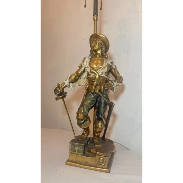 Crafted with an eye for elegance, this exceedingly large figural bronze clad table lamp brings a touch of antique...