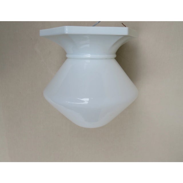 A ceiling light from the bauhaus period, produced by vlg weißwasser. this denunciation of vlg weißwasser was developed...