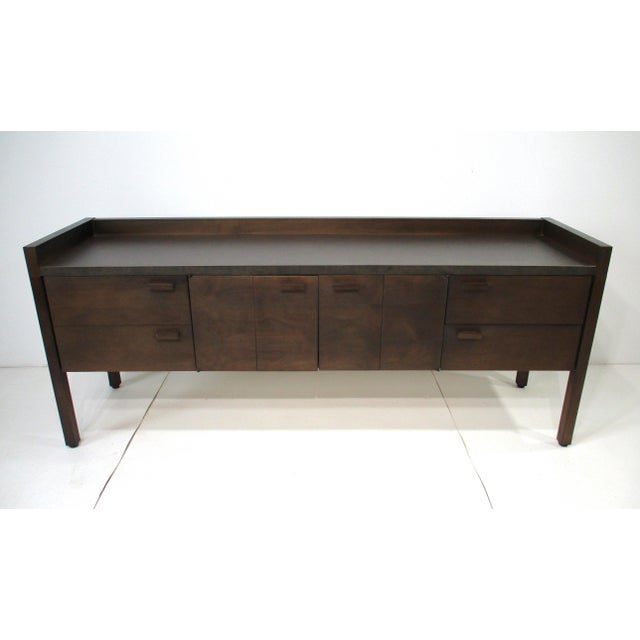 An exceptionally well-crafted Mid-Century credenza, sideboard or stereo equipment cabinet with one large drawer to the...