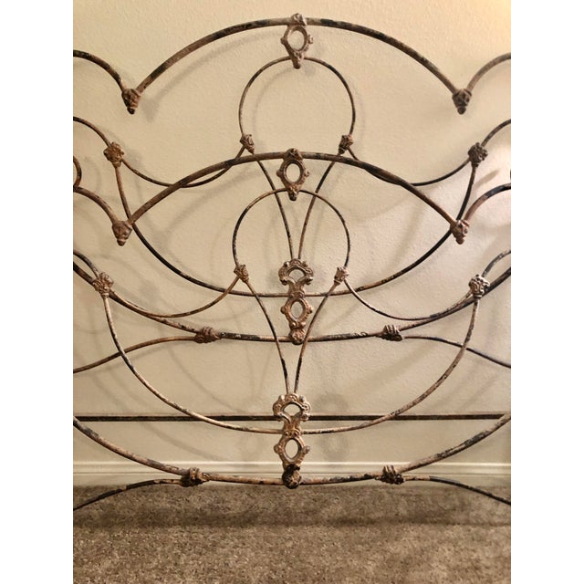 Antique Victorian Iron Bed This is an exquisite antique Victorian iron bed circa late 19th century. The king bed frame has...