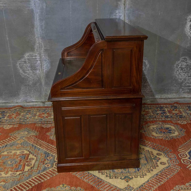This is a fine quality mahogany roll top desk from the very late victorian period complete with the original working lock...