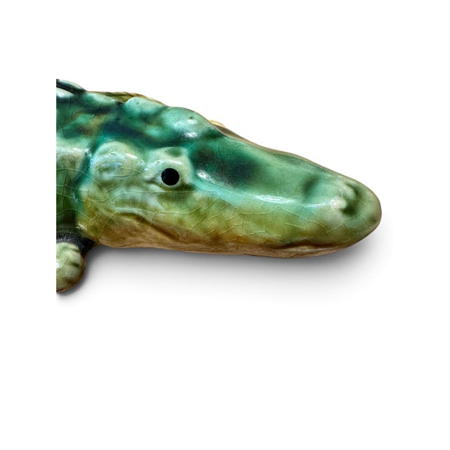Capture the whimsical spirit of Victorian naturalism with this exceptional Majolica-style ceramic alligator sculpture....