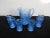 L Smith Art Glass Pitcher and 6 matching glass , sky blue color , floral impressed patterns . 6 glasses measured 3.25w...