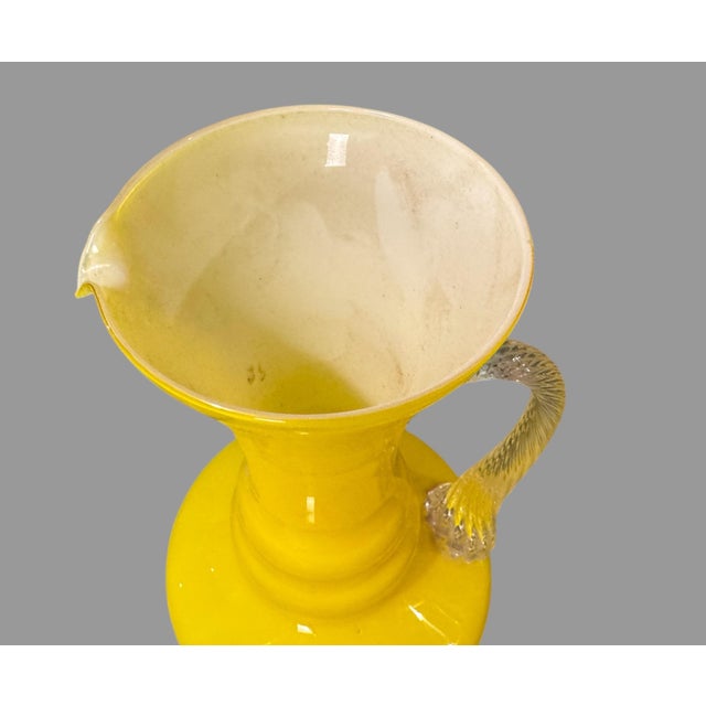 Vintage 12.25" Yellow Art Glass Ewer Pitcher with Twisted Clear Glass Handle In very good original condition showing some...