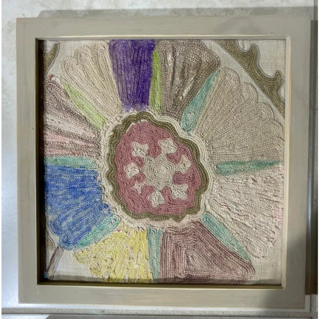 Beautiful set of four wall handing wood frames ,of silk or cotton hand embroidery Suzani textile , floral and vine motif ,...