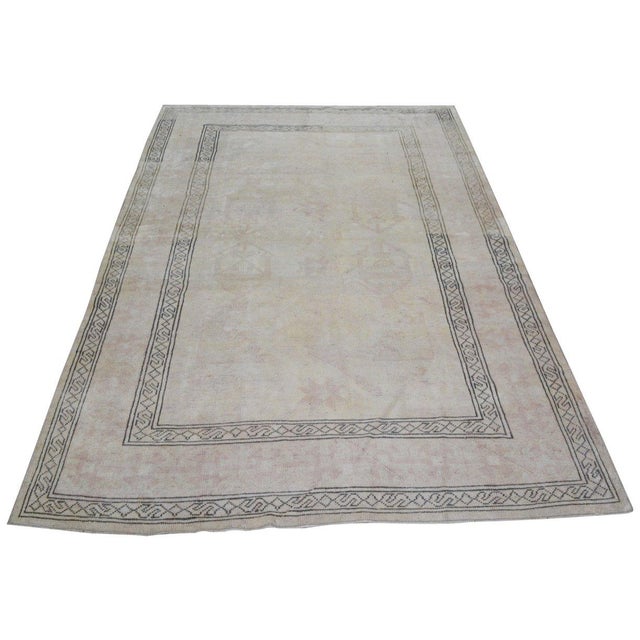 Hand-knotted with care using traditional rug-making techniques, this wool rug blends timeless craftsmanship with a modern...