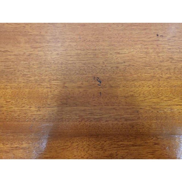 Fair condition. Usual traces and scratches of use, defects on the teak top and a more pronounced scratch on the glass top....