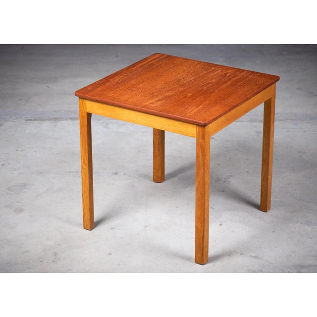 Side table with teak top and solid oak frame. Danish design from the 1960s. Beautiful side table in great condition. This...