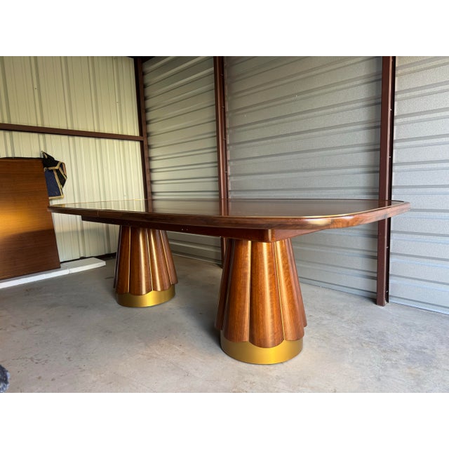 Retails for $18,291. Introduce an enduring statement of artistry and sophistication with the Baker Peplum Dining Table, a...