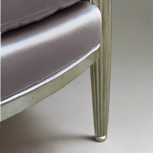 A fine pair of Art Deco white gold armchairs. White Gold leaf covered frame with fluted front leg details and slightly...