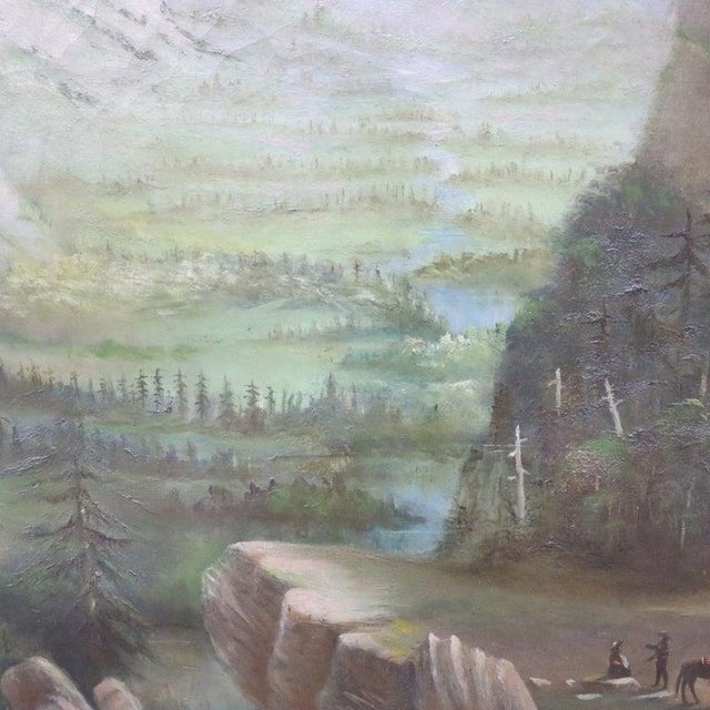 An antique oil on canvas painting depicting a Western mountain landscape, characteristic of the Hudson River School style....