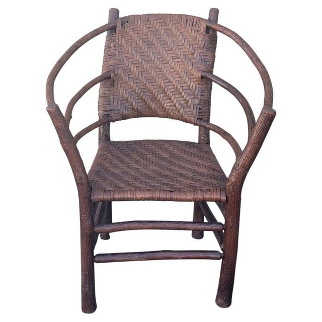 This fine signed Old Hickory barrel back arm chair is in fine condition.The original woven seat and backing is in very...