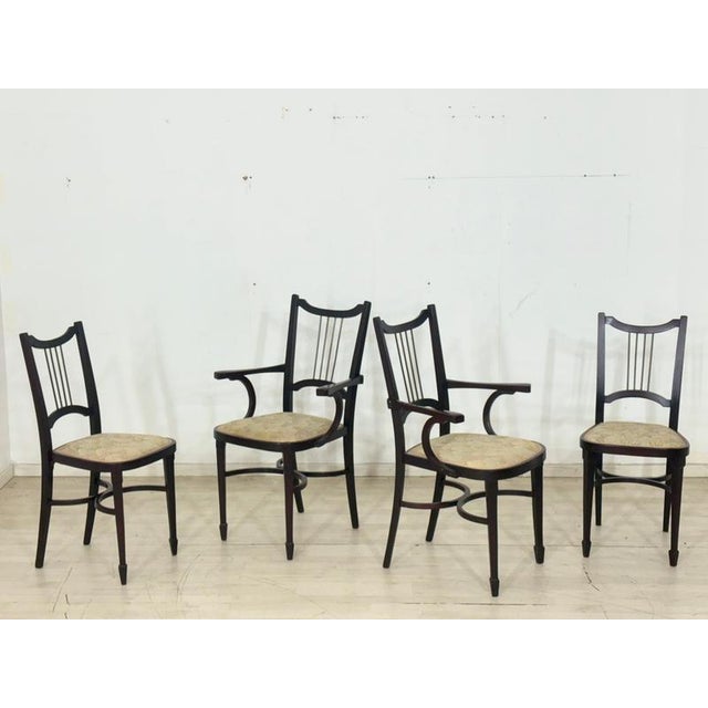 Exquisite set of four original Thonet chairs from around 1900. These antique pieces impress with their elegant lines and...