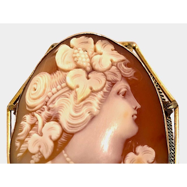 This beautiful piece is an authentic Victorian shell cameo configured to function as both a brooch pin and a pendant. It...