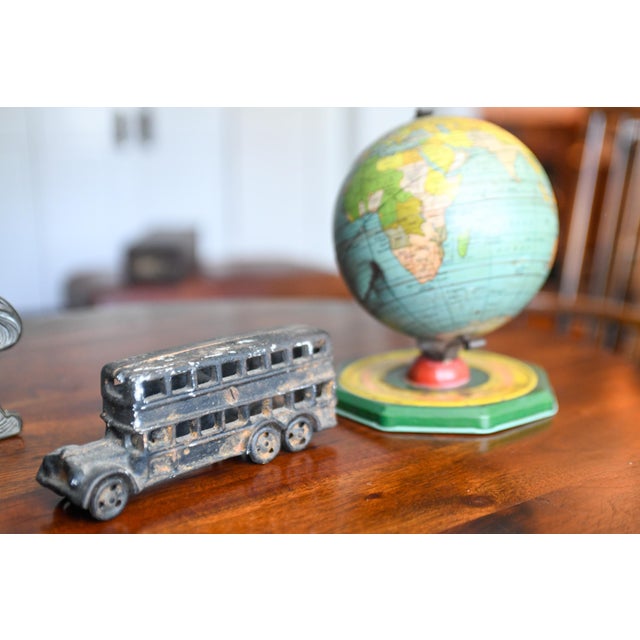 Produced by the A.C. Miller Company of Ravenna, Ohio in 1928, this cast iron double decker bus measures about 7.5" long...
