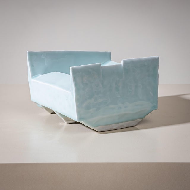 Elongated rectangular bowl by Masamichi Yoshikawa, covered in a translucent pale blue Seihakuji glaze. The restrained form...