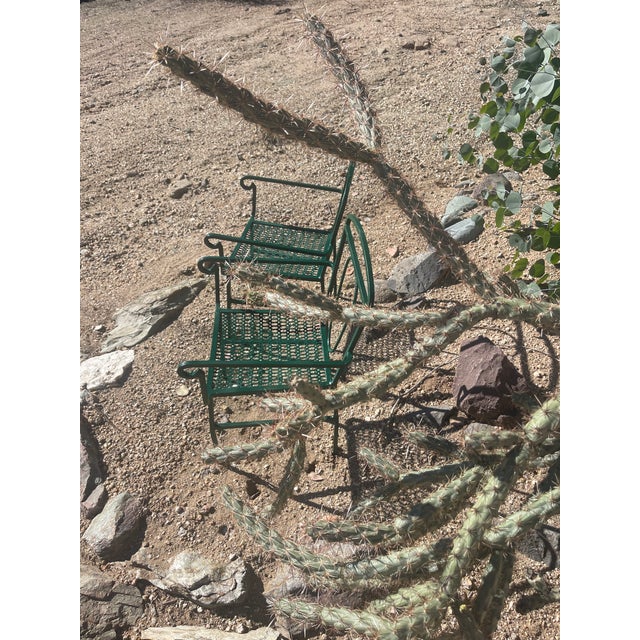 Pair antique cast iron chairs, children’s sized. Seats are pierced. Legs are joined by horizontal stretchers, chairs are...