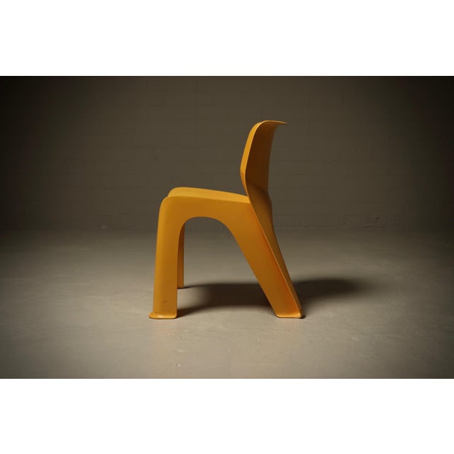 Sculptural monobloc chair crafted in yellow ABS plastic and dating from the late 1970s. The design is defined by its...