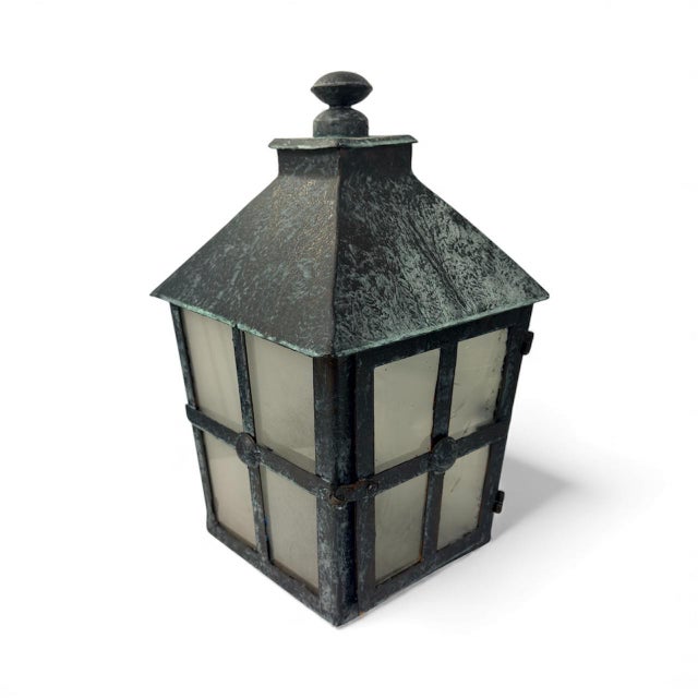 This is an attractive, vintage-style outdoor lantern designed for use with a real candle, offering an authentic, warm, and...