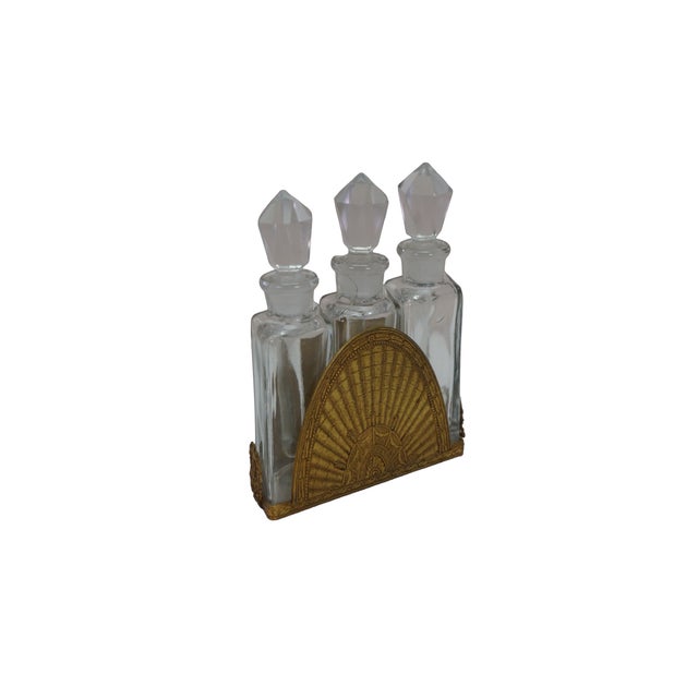 This antique three-bottle perfume vanity set is a spectacular example of early 20th-century decorative art, featuring...