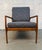 Timeless mid-century style to your space with this beautifully crafted walnut lounge chair. Featuring a solid walnut frame...