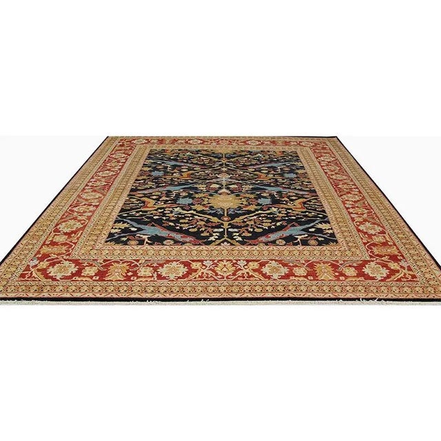 Traditional Handwoven Serapi Style Area Rug featuring an allover design in a black-colored field enclosed in a red-colored...