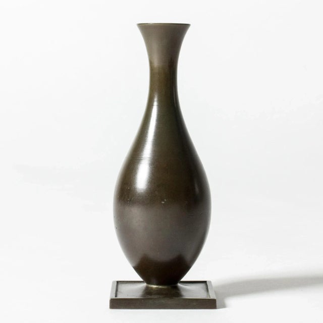 Lovley bronze vase from GAB, patinated dark green in varying nuances. Classic shape with a wide square base. This piece...