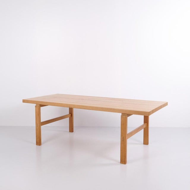 Rectangular solid oak coffee table from the 1970s. Danish design with visible mortise and tenon joints and fine...