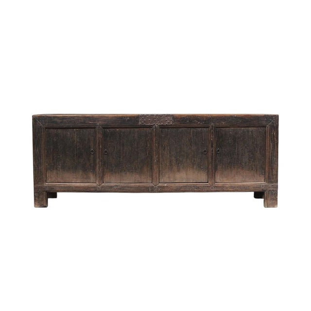 This vintage sideboard is made from reclaimed solid wood featuring a weathered, dark charcoal brown finish with rustic...