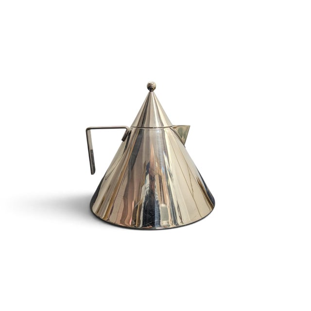 The "Il Conico" kettle is an icon of industrial design, designed by architect Aldo Rossi for Alessi in 1984. This...