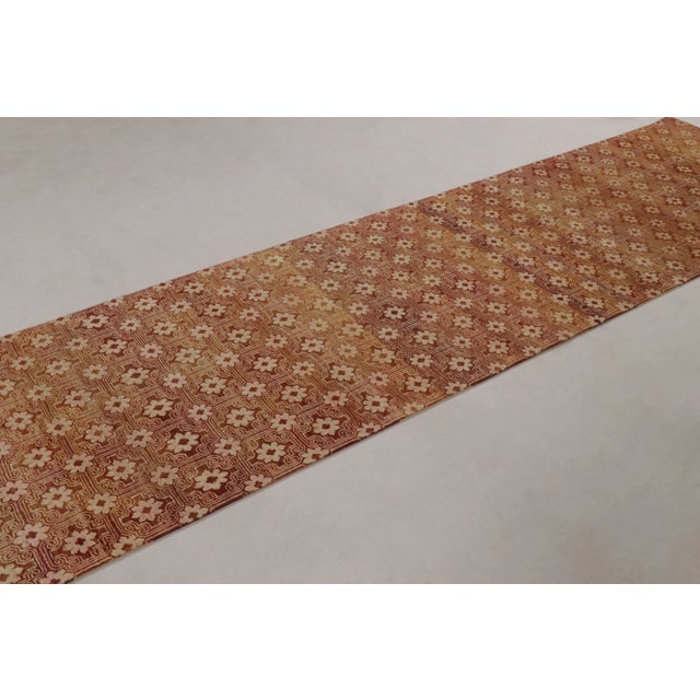 This magnificent 3x12 runner rug from Rug & Kilim features a dense, finely crafted all-over geometric lattice pattern with...