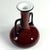 A highly decorative bottle, handcrafted from colored, layered glass. Designed by Michael Povolný, it comes from the Loetz...