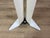 White painted metal floor lamp, Copricorno model, designed by Afra and Tobia Scarpa for Flos in the 1980s. The lamp has...
