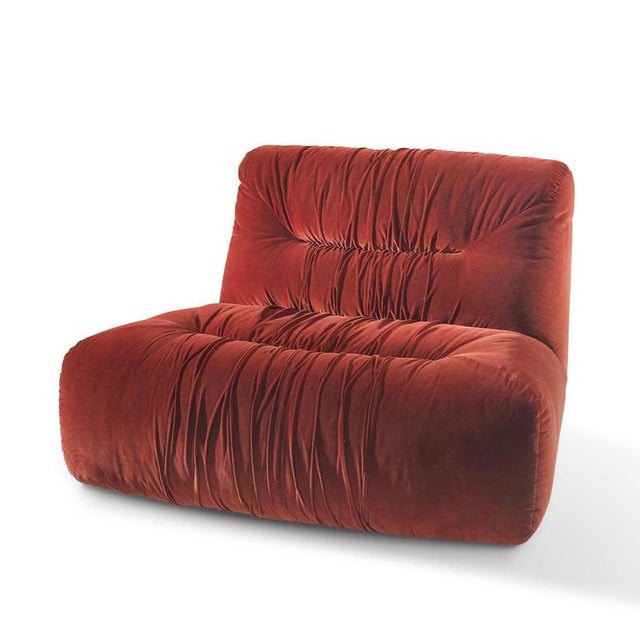 A sculptural lounge piece by Lorenza Bozzoli, defined by its generous proportions and sinuous, enveloping silhouette. The...