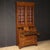 English double-body cabinet from the mid-20th century. Georgian-style furniture carved and veneered in walnut, mahogany,...