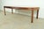 An exceptional mid-century modern Hollywood Regency Chinoiserie sculpted walnut extension dining table By Thomasville USA,...