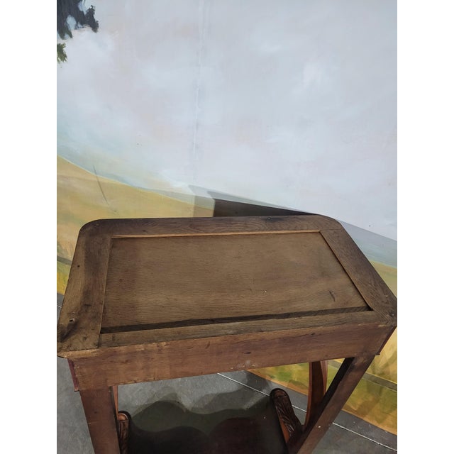 Elegant mahogany console from the restoration period. This model is rather high in size, the top is in Saint Anne marble....