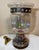Very unique vintage Mexico Derflingher style hand blown iridescent caged glass hurricane lamp with blackened copper. The...