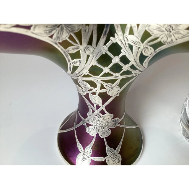 Remarkable Loetz iridescent sterling silver overlay art glass basket vase. The fan shaped basket with pure sterling silver...