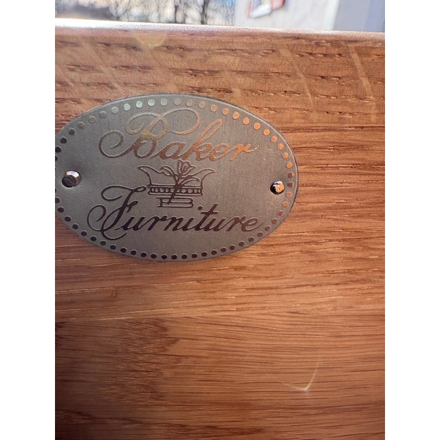 This is a late 20th century English Georgian revival style chest of drawers. This Chest of drawers has its original highly...