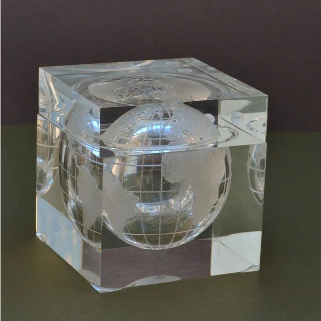 Lucite cube bar ware depicting the world captured in a cube of acrylic that resembles an ice cube. Frosted world map of...
