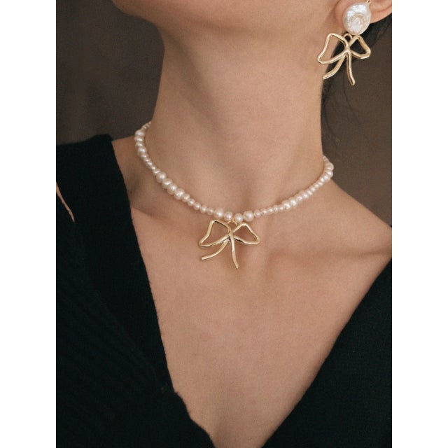 New additions to our Bow styles, the perfect styles for all end-of-year festivities! The Pearls & Bows Choker is Handmade...