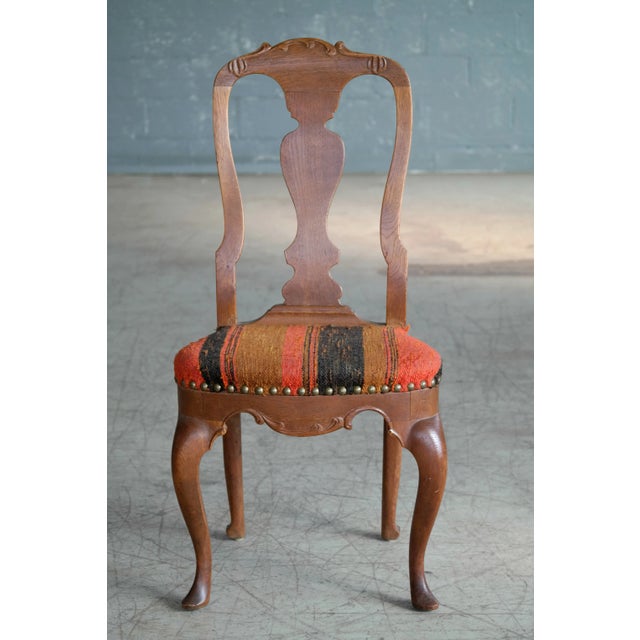 Classic Danish chair. Beautiful wood detail. Great as a side chair or an accent chair. Fabric is in great condition.