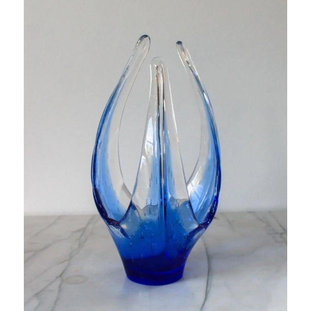 Stunning vintage freeform blue hand made glass art bowl. No makers mark. Minor age wear. No chips.